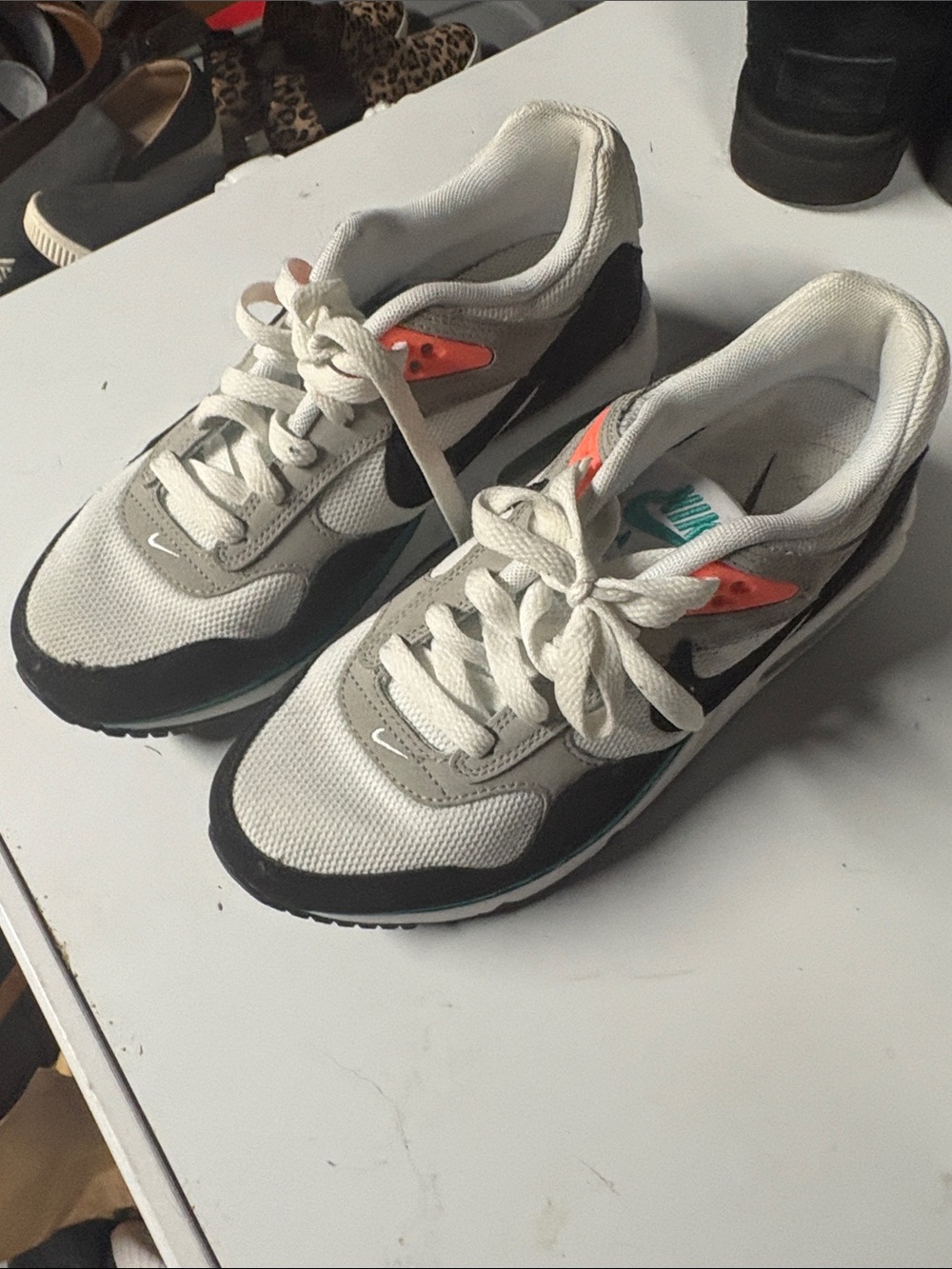 Women’s Nike  White and Black Athletic Sneakers with Teal and Orange Accents